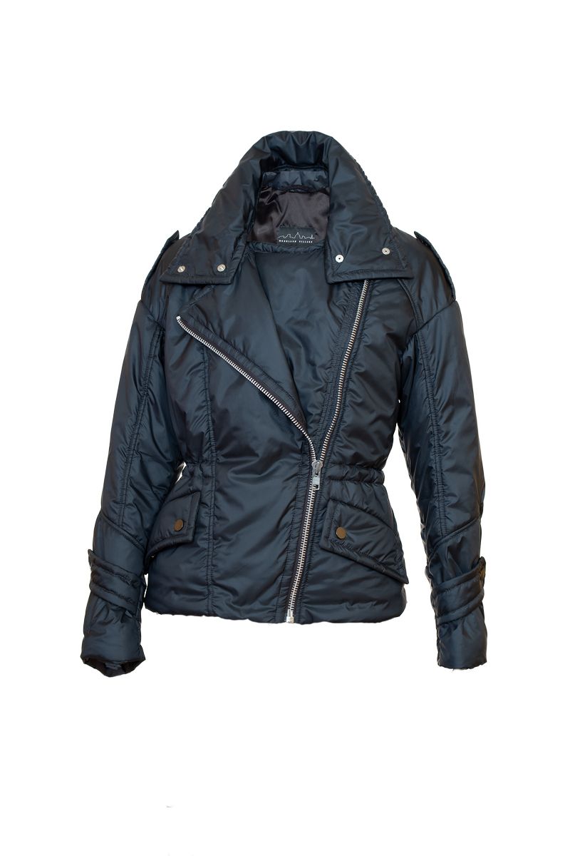 Model wearing Aster alpaca jacket stadning on the patio