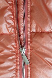 Model wearing Solstice Alpaca insulated puffer jacket on a podium at Montreal Fashion Week runway